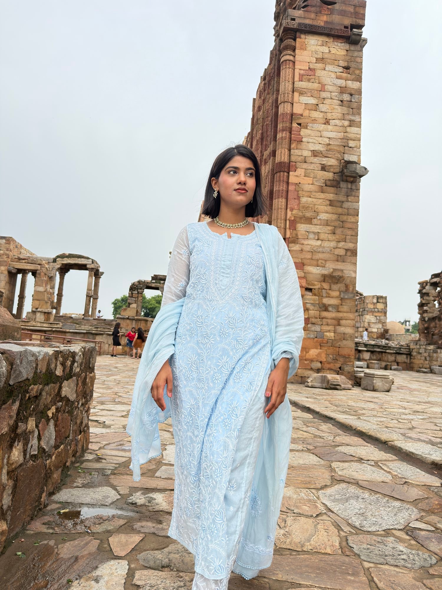 Model in a powder blue Chikankari kurta set at a heritage monument